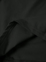 Jupe noire mi-longue fendue à volants plissés