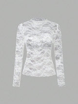 Chemisier en dentelle à col montant manches longues