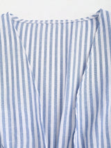 Blouse à manches évasées avec ceinture nouée et rayures