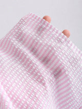 Ensemble deux pièces top rayé et pantalon long