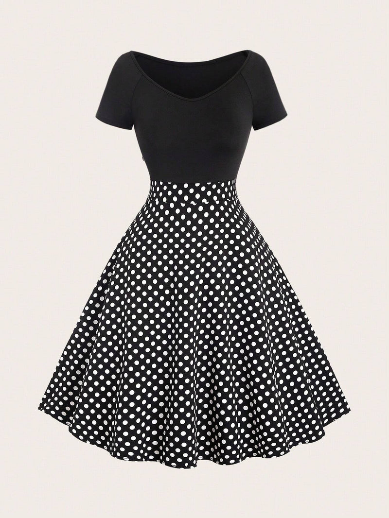 Robe noire à pois col en V et épaules structurées