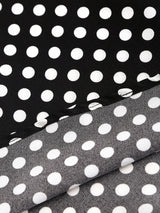 Robe noire à pois col en V et épaules structurées