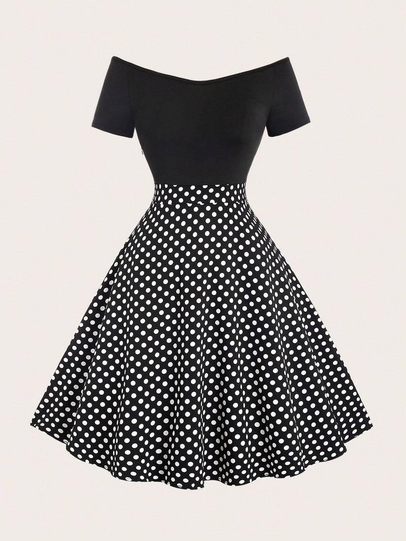 Robe noire à pois col en V et épaules structurées