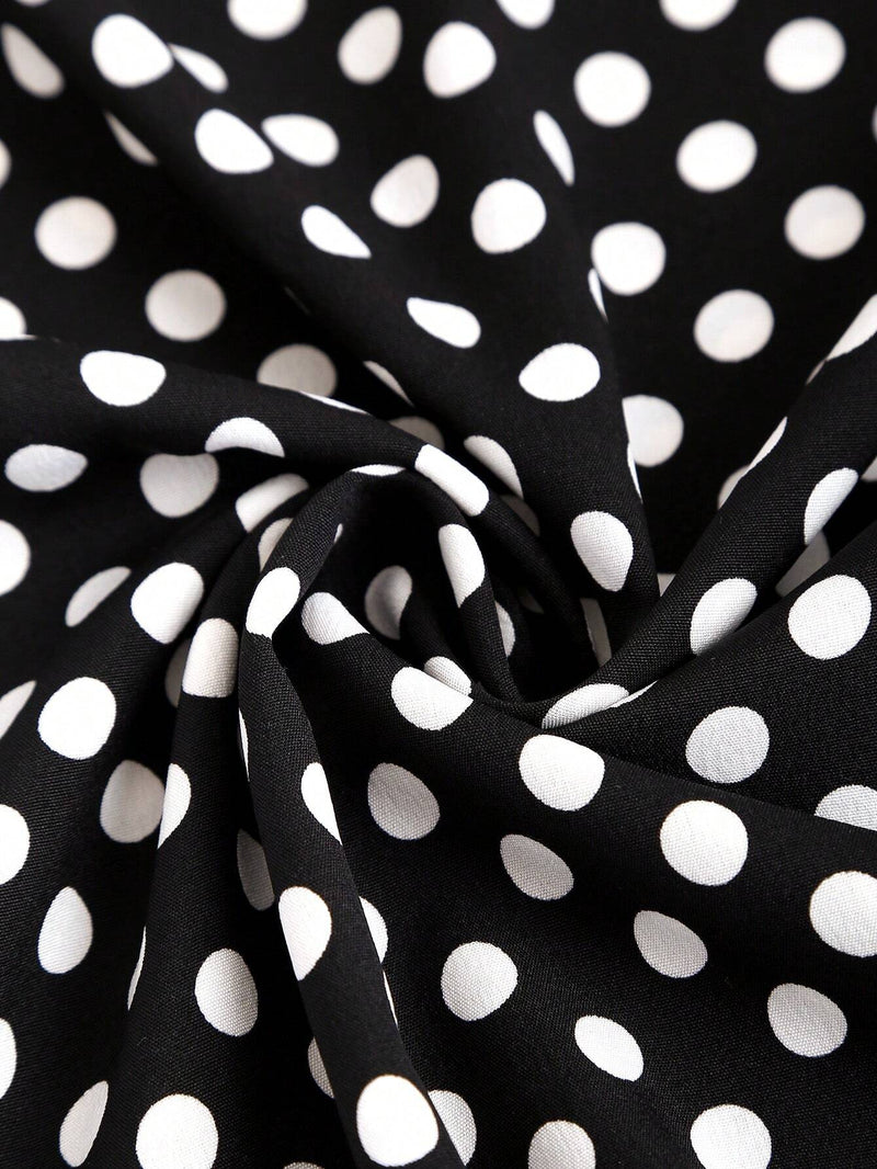 Robe noire à pois col en V et épaules structurées