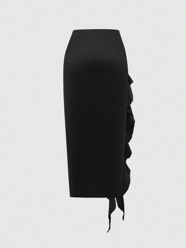 Jupe noire mi-longue fendue à volants plissés