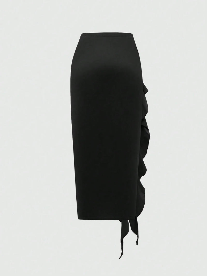 Jupe noire mi-longue fendue à volants plissés