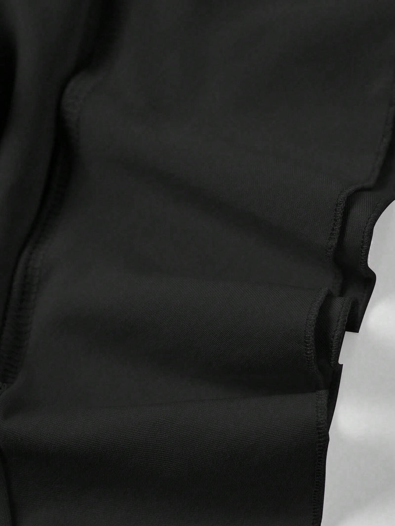 Jupe noire mi-longue fendue à volants plissés