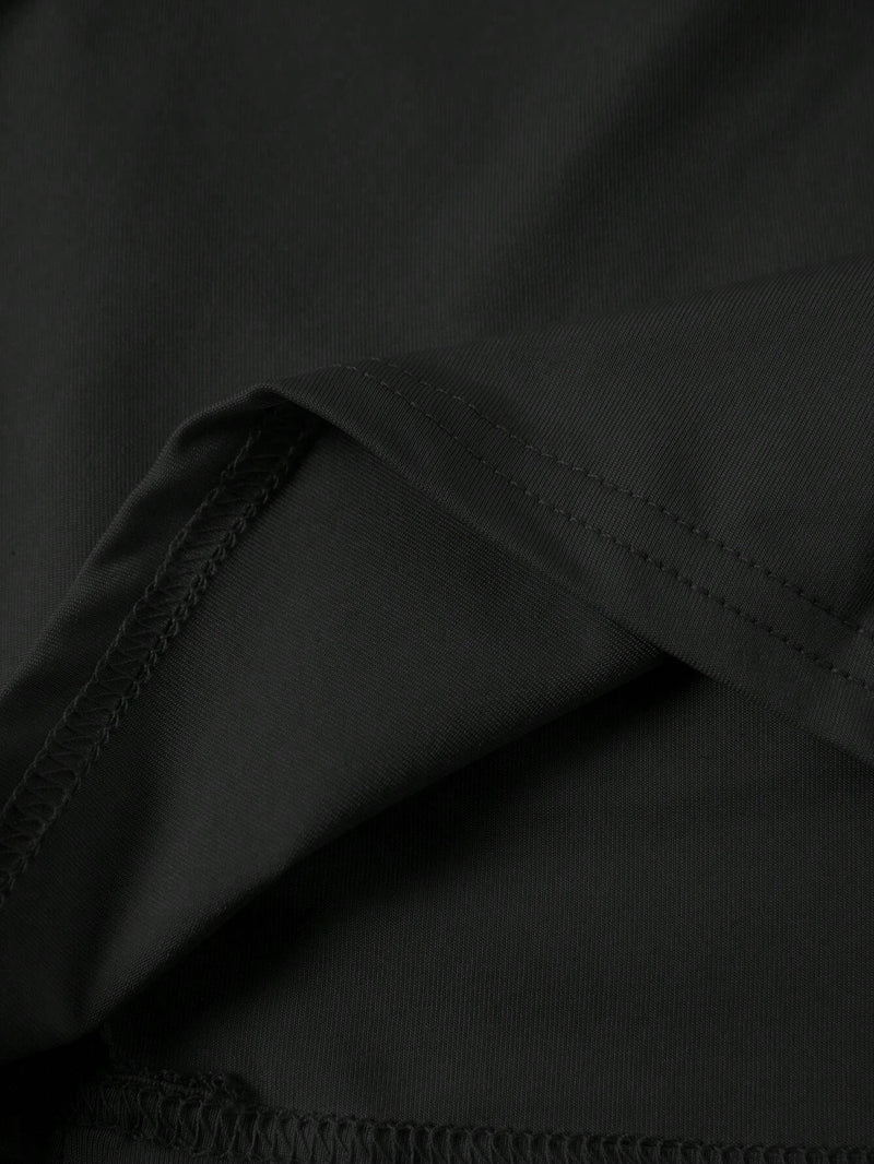 Jupe noire mi-longue fendue à volants plissés