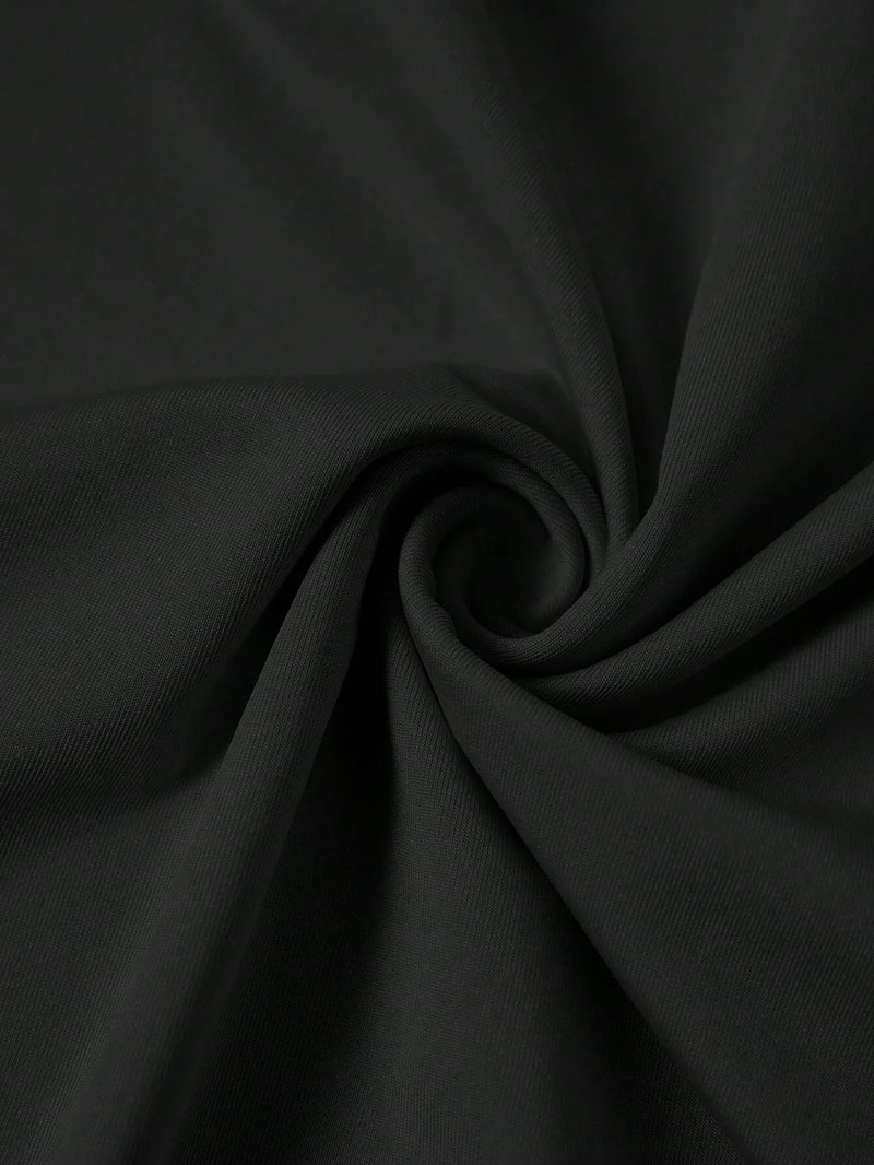 Jupe noire mi-longue fendue à volants plissés