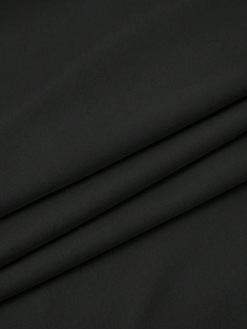 Jupe noire mi-longue fendue à volants plissés