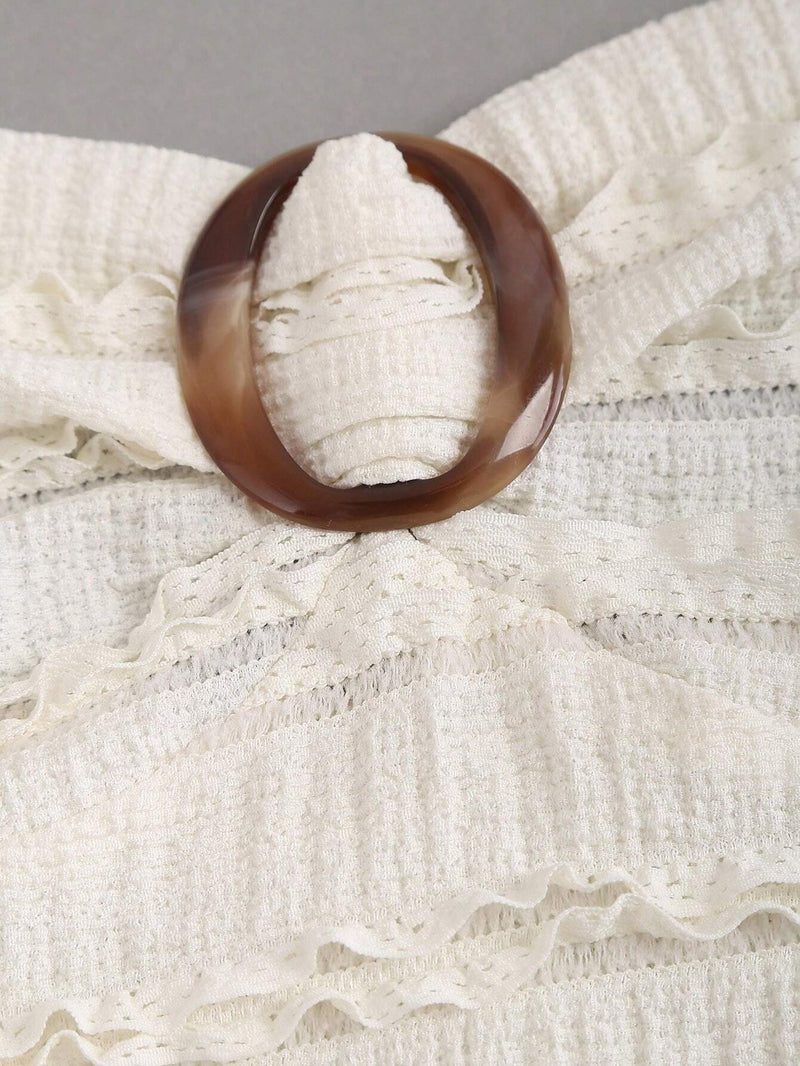 Robe longue ras-du-cou avec anneau à dos-nu et ourlet volanté