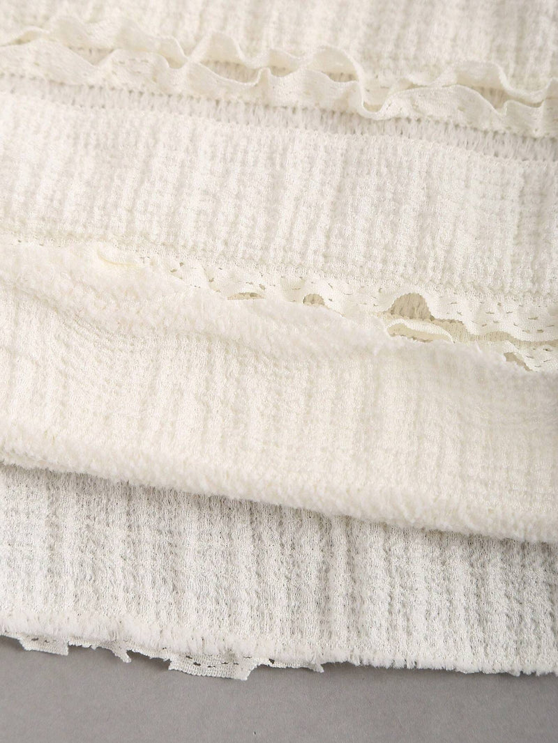 Robe longue ras-du-cou avec anneau à dos-nu et ourlet volanté