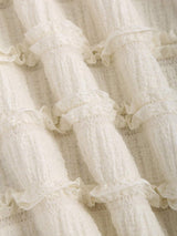 Robe longue ras-du-cou avec anneau à dos-nu et ourlet volanté