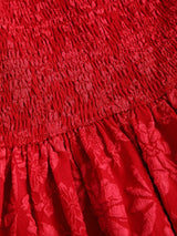 Robe courte dos nu à taille marquée et coupe évasée