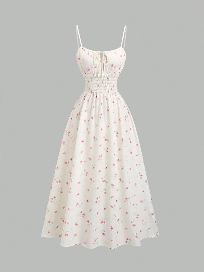 Robe longue fleurie à fines bretelles et nœud à la taille